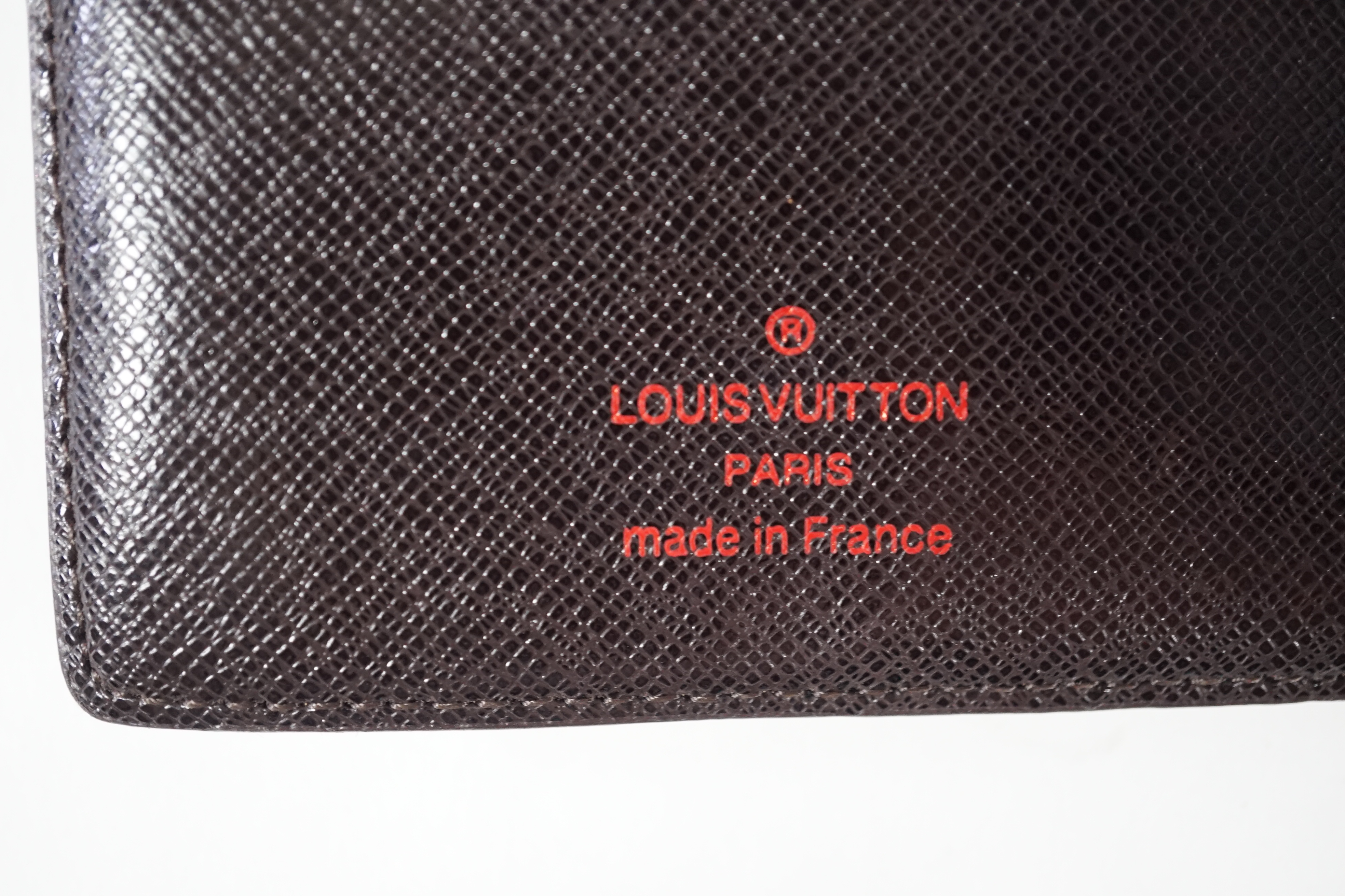 A Louis Vuitton bifold Damier coated canvas Marco wallet, height 10cm, width 11cm